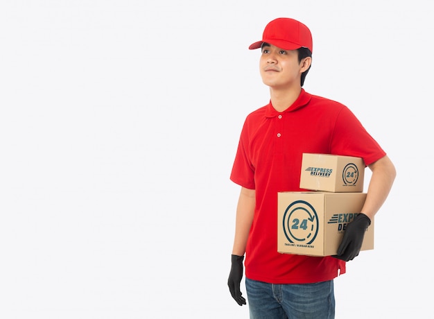 Young delivery man holding paper cardboard box mockup