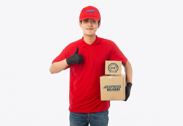 Young delivery man holding paper cardboard box