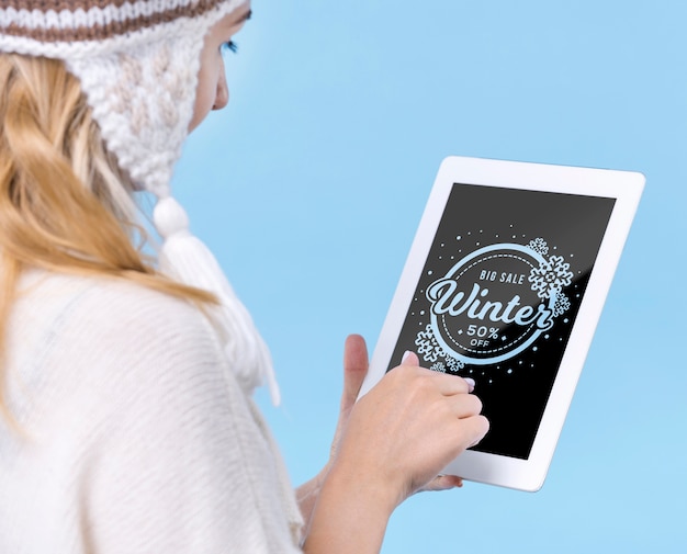 Young girl touching tablet with mock-up