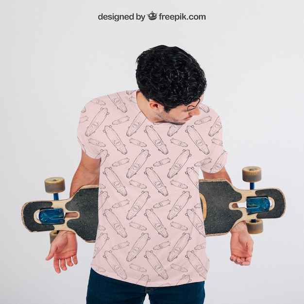 Young guy with skateboard and t-shirt’s mock up – Free PSD Template Download