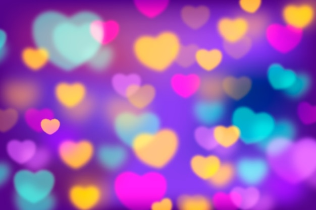 Abstract background with colorful bokeh hearts