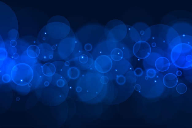 Free vector abstract blue bokeh lights background