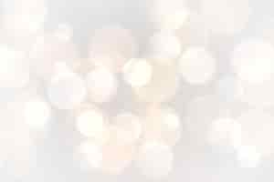 Free vector abstract white bokeh glowing lights background