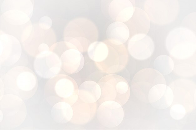 Abstract white bokeh glowing lights background 
