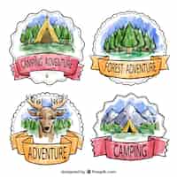 Free vector adventure badges in watercolor style