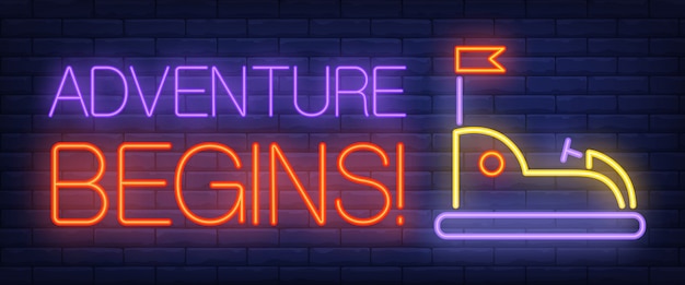 Adventure begins neon text with bumper car