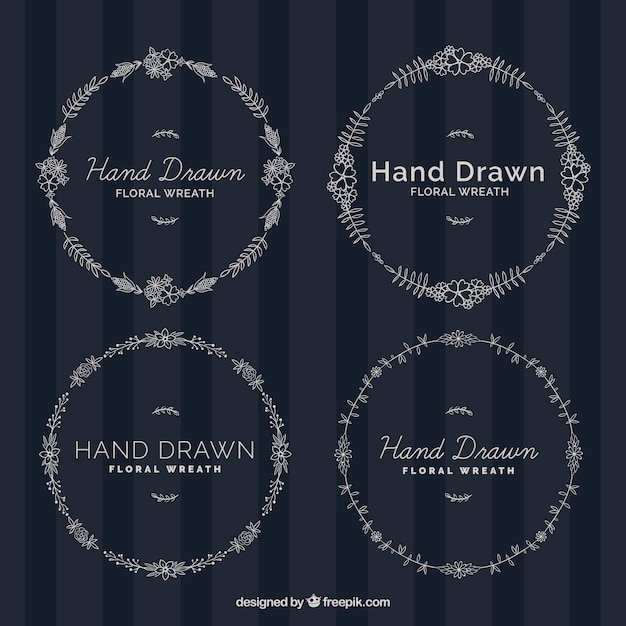 Free vector assortment of four hand-drawn floral wreaths