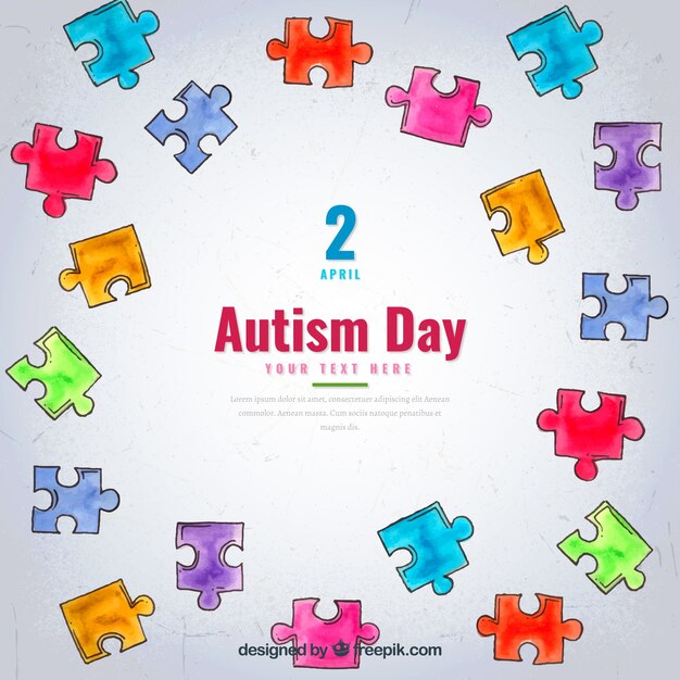 Autism day background with watercolor puzzle pieces