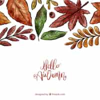 Free vector autumn background with watercolor leaves