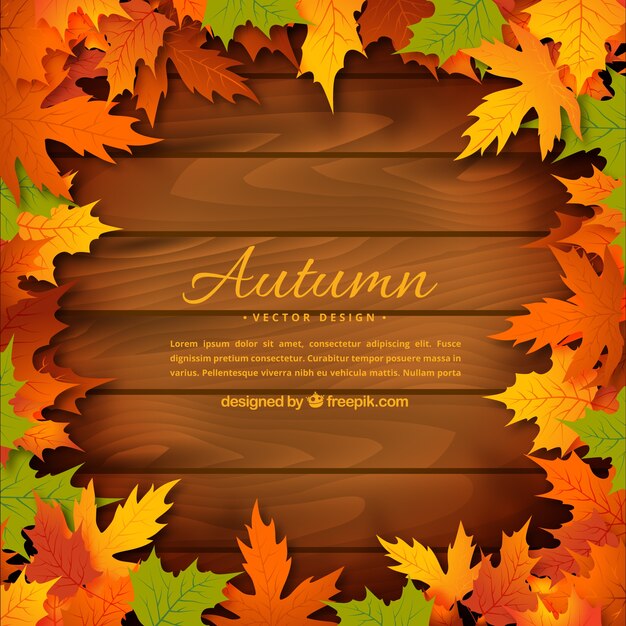 Autumn leaves on wooden background