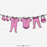 Free vector baby girl clothing hanging on a rope