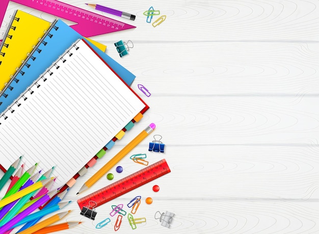 Back to school realistic background with colorful stationary on wooden surface