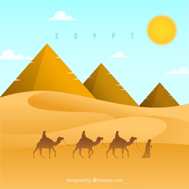 ラクダのキャラバンとエジプトのピラミッドの風景の背景