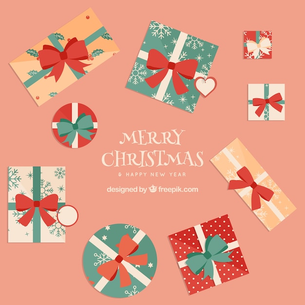 Free vector background of nice gift boxes in flat design