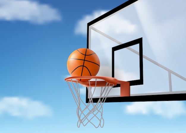 Basketball ball falling into ring net at backboard