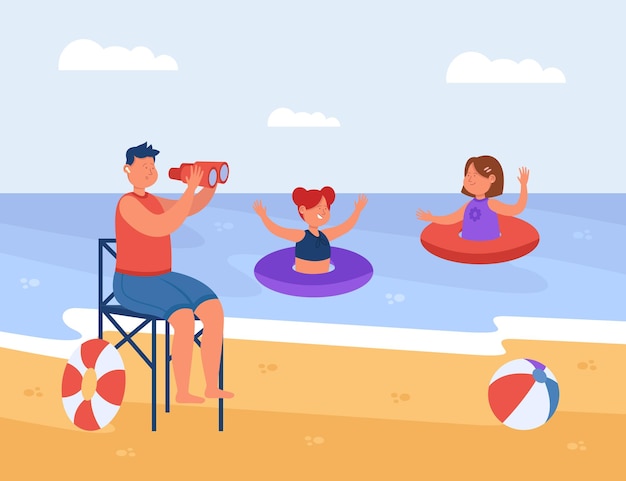 Beach lifeguard watching swimming children in water