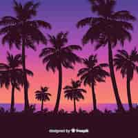 Free vector beach sunset with palm silhouettes