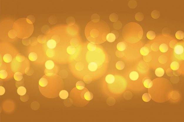 Free vector beautiful golden bokeh lights background wallpaper design