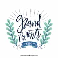 Free vector beautiful lettering of grandparents day in vintage style with floral decoration