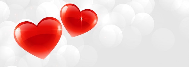 Beautiful two shiny hearts banner background