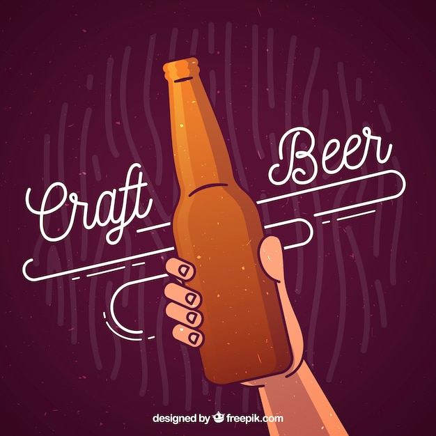 Beer background with hand holding bottle