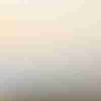 Free vector beige blurred background