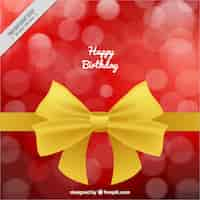 Free vector birthday background with golden ribbon and bokeh effect