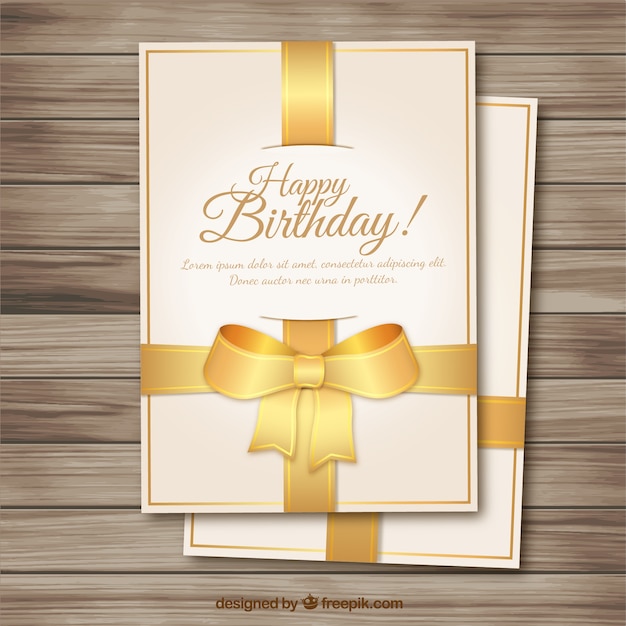 Birthday card with a golden bow