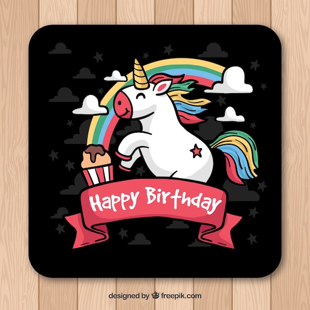 Free vector birthday card with hand drawn unicorn