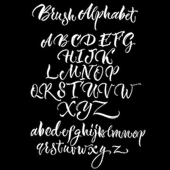 Black background with white scrawling alphabet