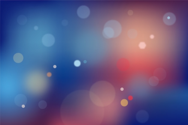 Free vector blue and red gradient background with bokeh effect