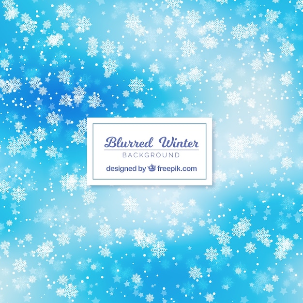 Free vector blue winter background with bokeh effect