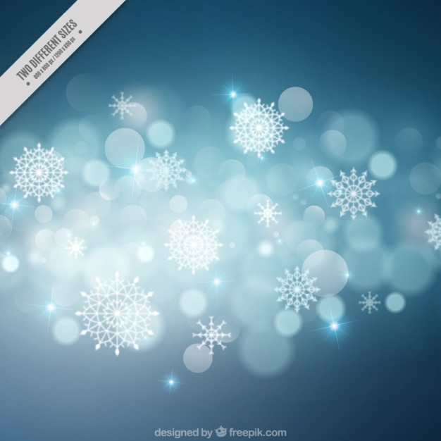 Free vector blurred bokeh background of snowflakes