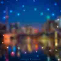 Free vector blurred city background with bokeh effect