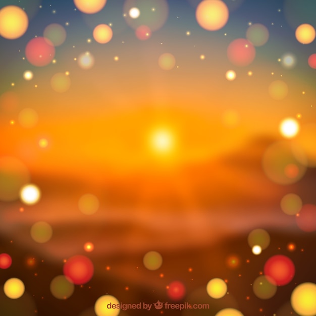 Free vector blurred landscape at sunset background