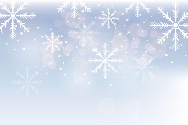 Free Vector blurry snowflakes in winter background