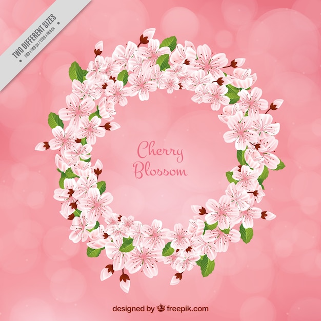 Bokeh background with decorative floral wreath of cherry blossoms