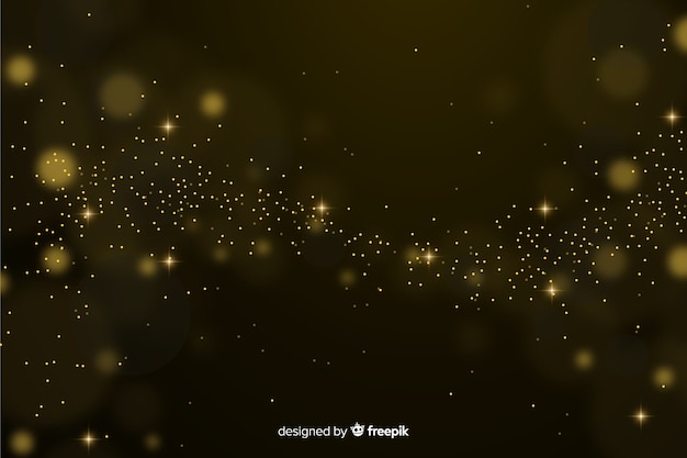 Bokeh background with golden particles Free Vector