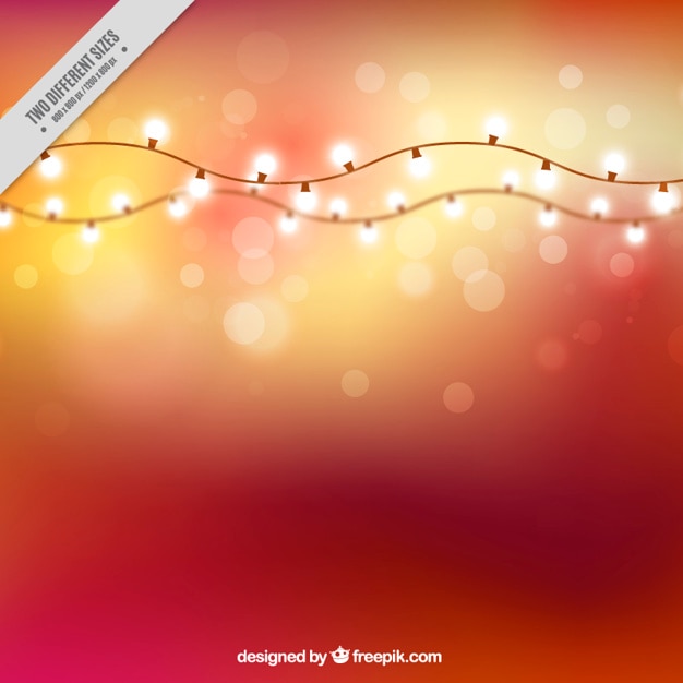 Free vector bokeh effect background with garlands of lights