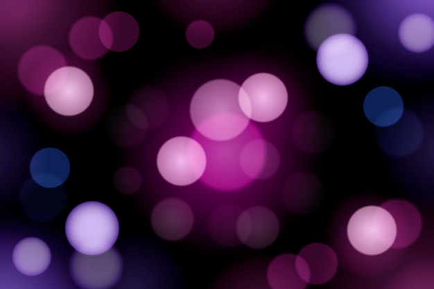 Bokeh gradient violet lights on dark background