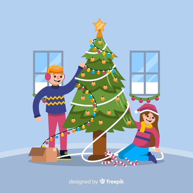 男の子と女の子のクリスマスツリーを飾る