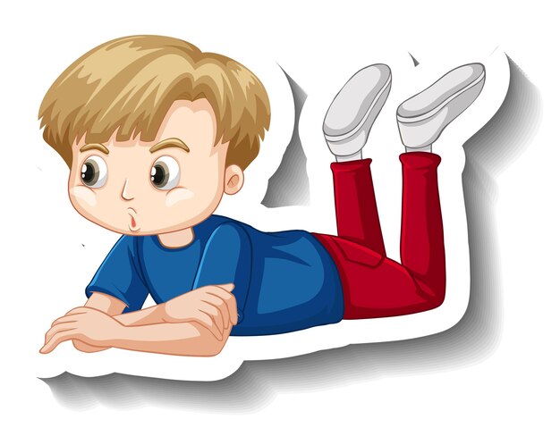 地面の漫画のステッカーに横になっている少年