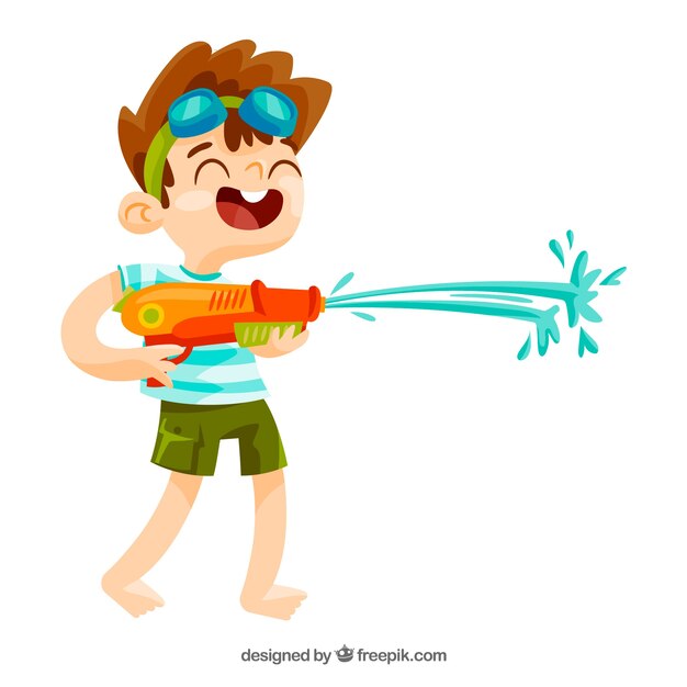 Мальчик играет с водяным пистолетом