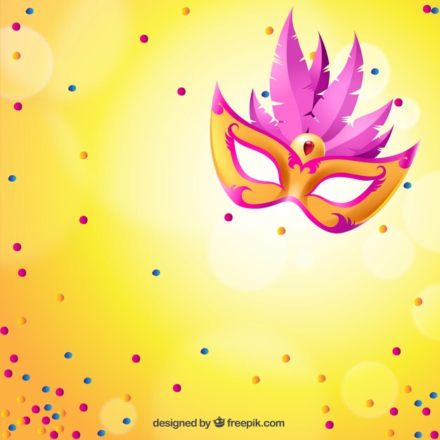 Bright carnival mask with pink feathers