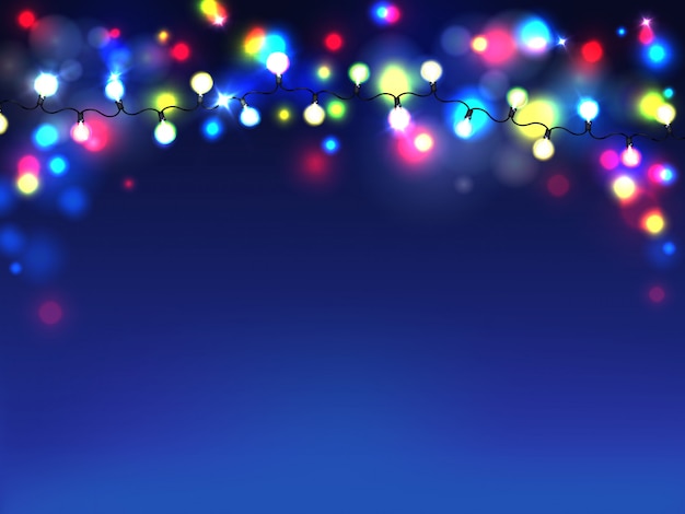 bright garlands isolated on blue background. Diffuse lights of electric bulbs 