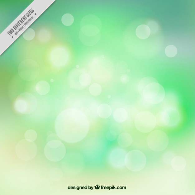 Free vector bright green background in bokeh effect