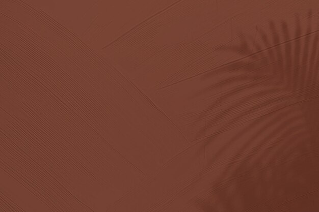 Brown textured background with tropical leaf shadow
