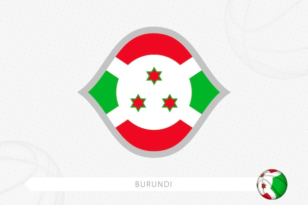 회색 농구 배경에서 농구 경기를 위한 부룬디 깃발.
