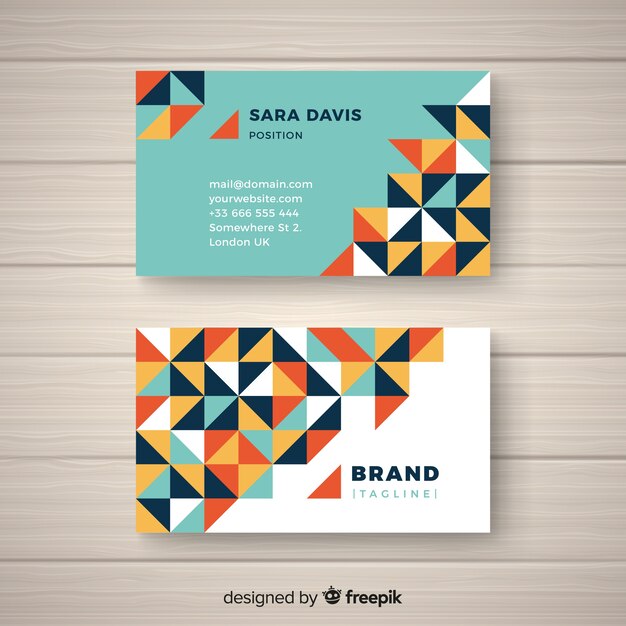 Free vector business card template with abstract shapes