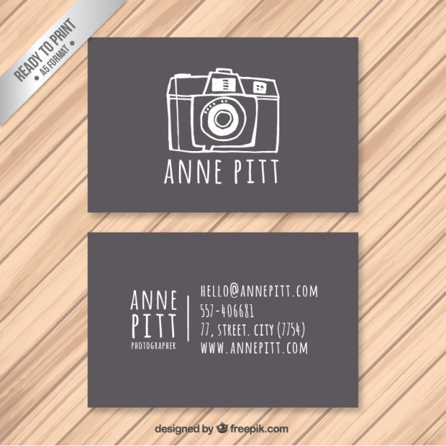 Free vector business card with hand drawn camera